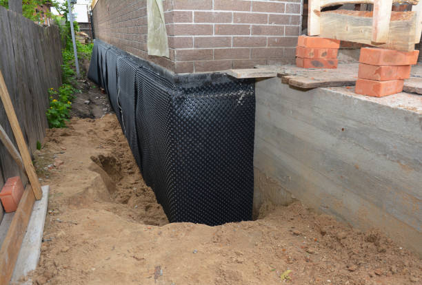 Happy homeowners after waterproofing job in Rossville